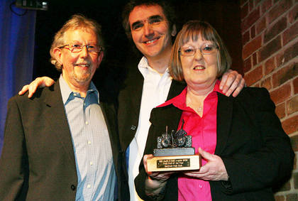 Pam & Alan receive the award from Jez Lowe